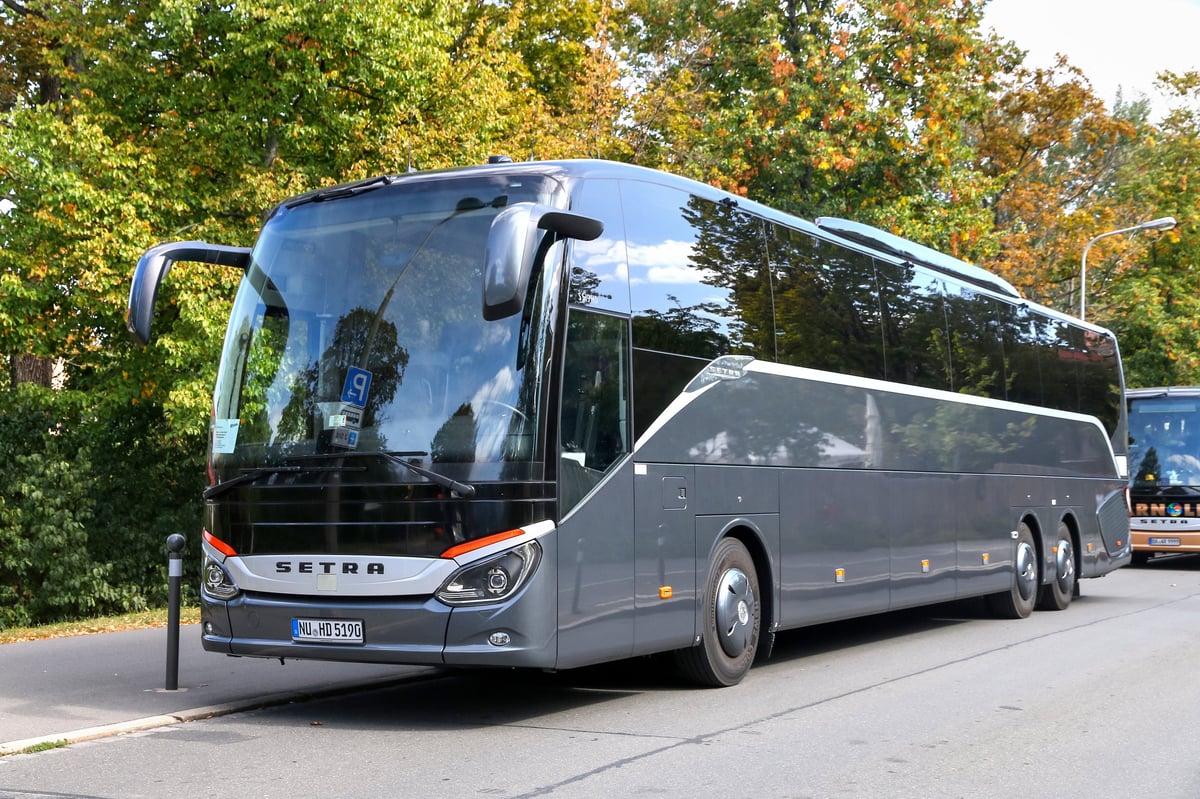 Modern tour coach parked on a city street